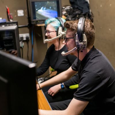 Production Arts student at a sound desk